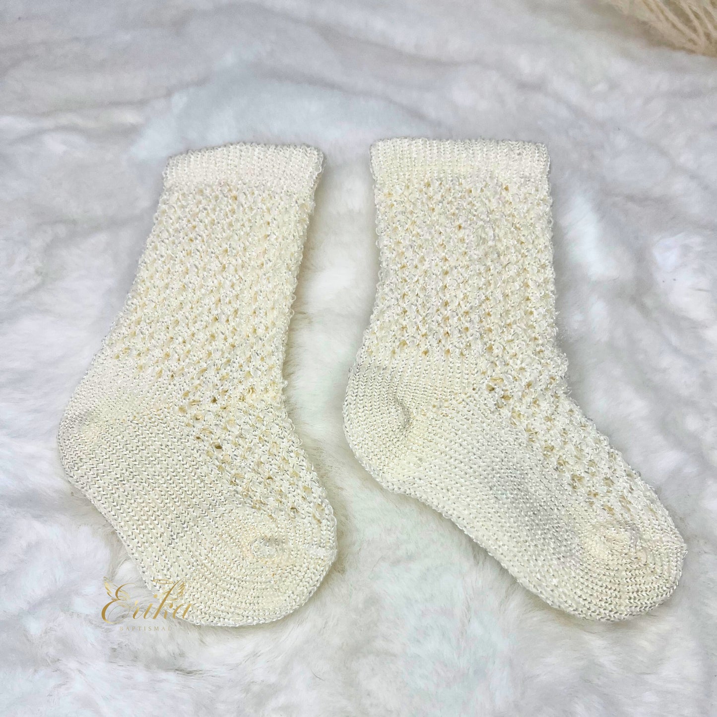 Ivory knee-high baptism socks with traditional pointelle stitching for infant girls