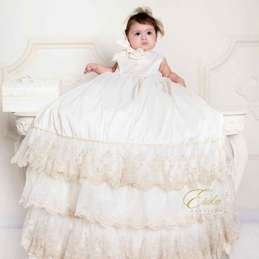 ivory baby christening gown with delicate lace and a very fluffy matching bonnet in soft elegant fabric