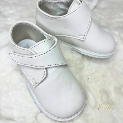 simple white baby boy baptism shoes with minimal design and soft material