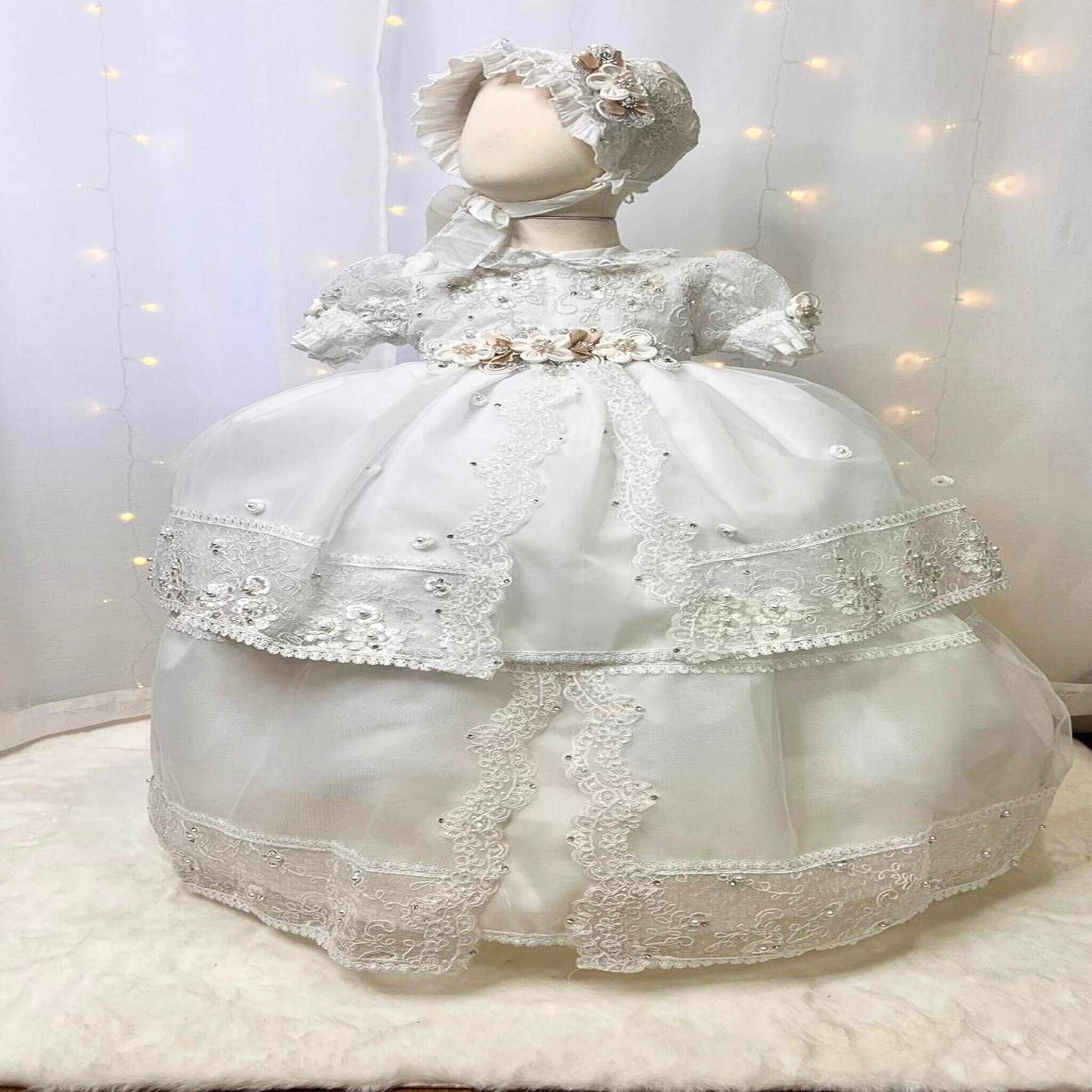 inexpensive white baby christening dress with floral details and soft lightweight fabric