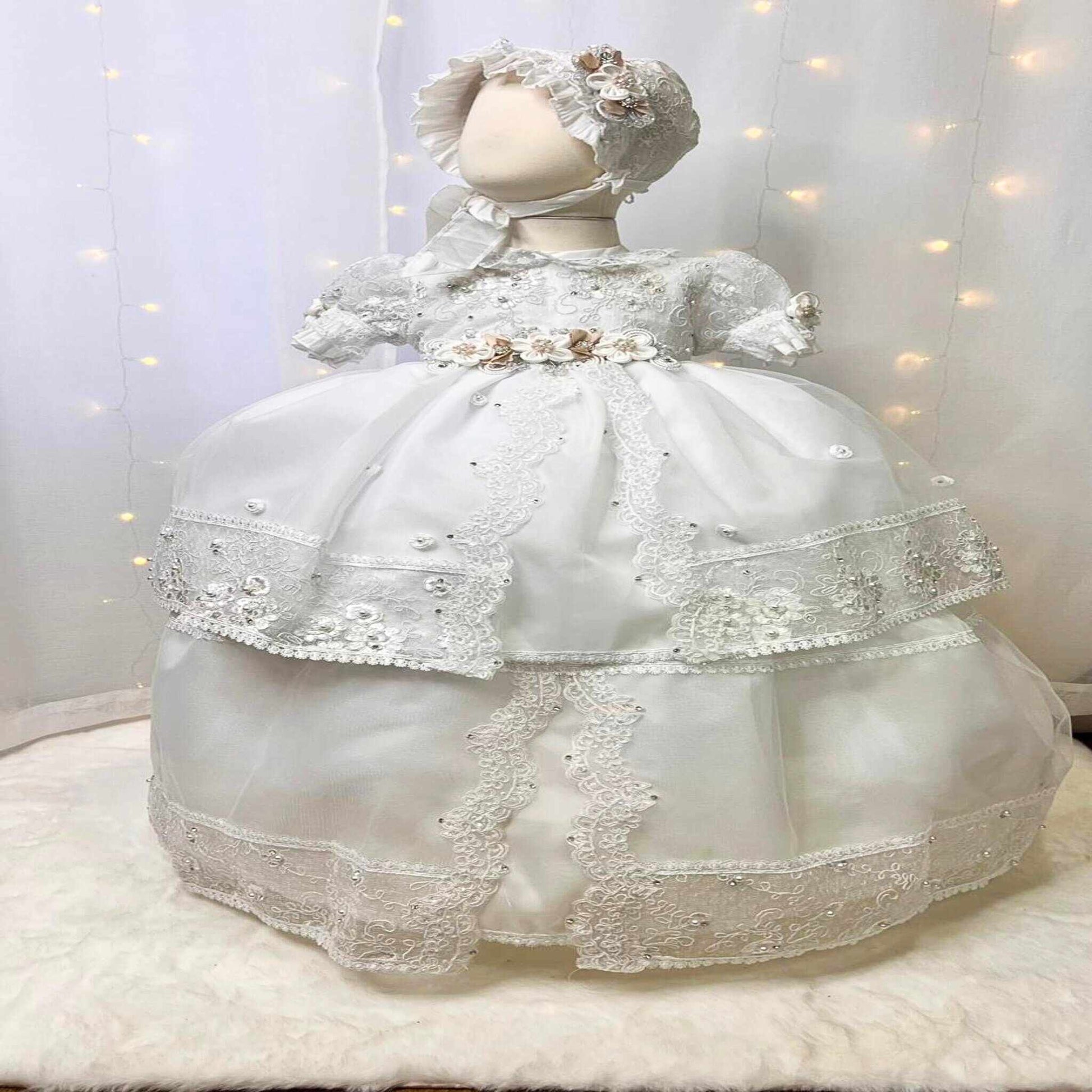 inexpensive white baby christening dress with floral details and soft lightweight fabric