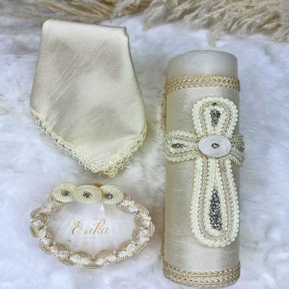 Minimalist boy's white baptismal set with discrete pearl borders on the candle