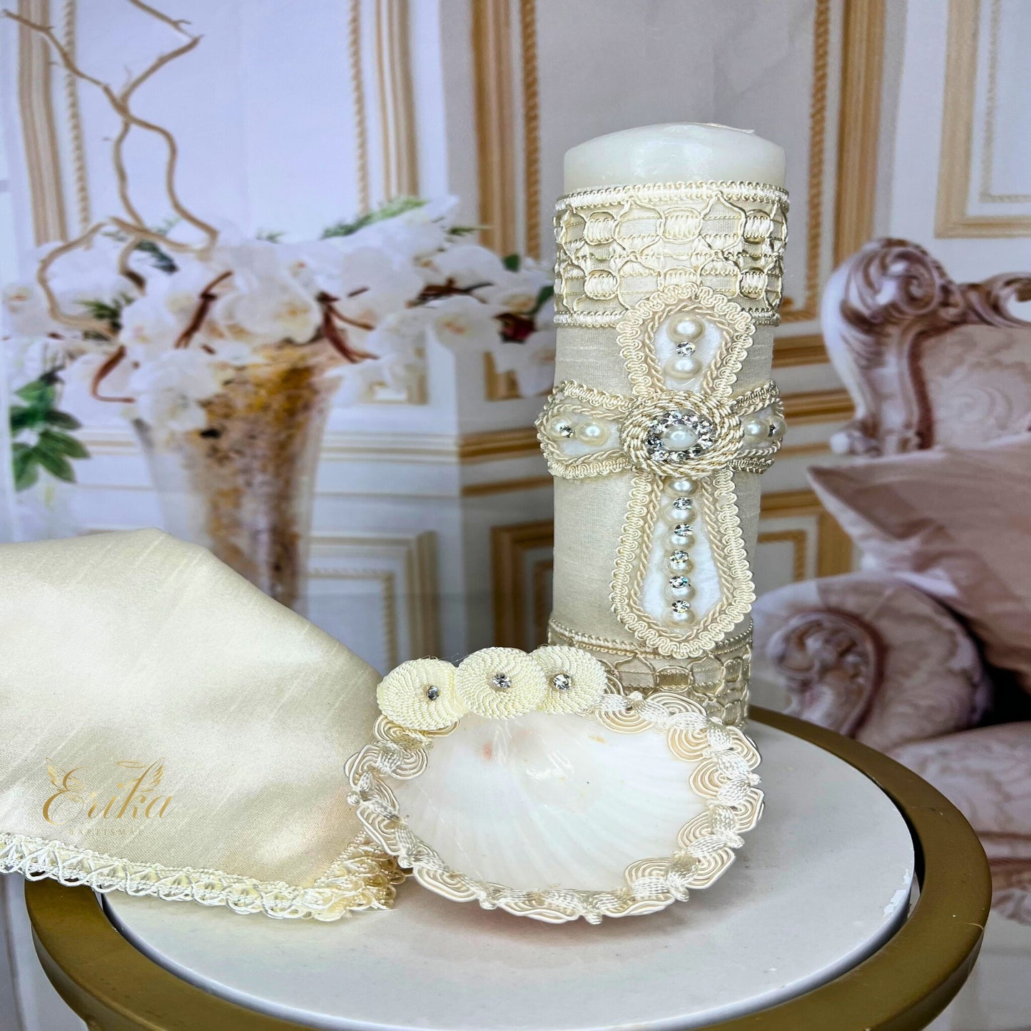 Complete baby baptism set including a decorated white candle, shell, and lace-trimmed drying towel
