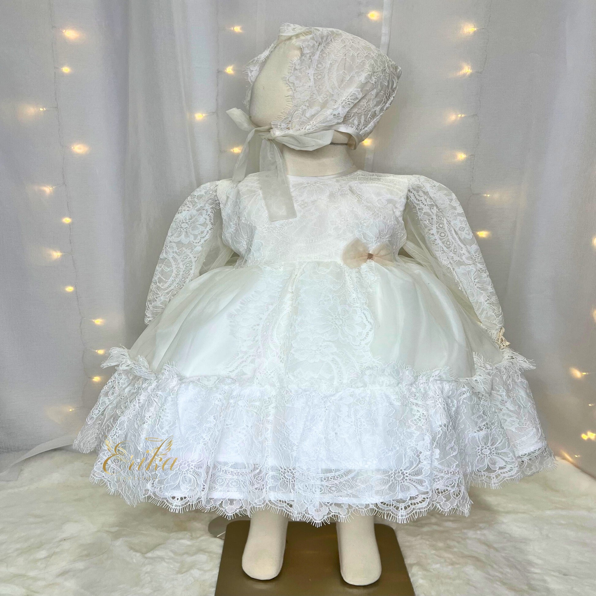 traditional long baby baptism gown in Spanish style with elegant details and soft flowing fabric