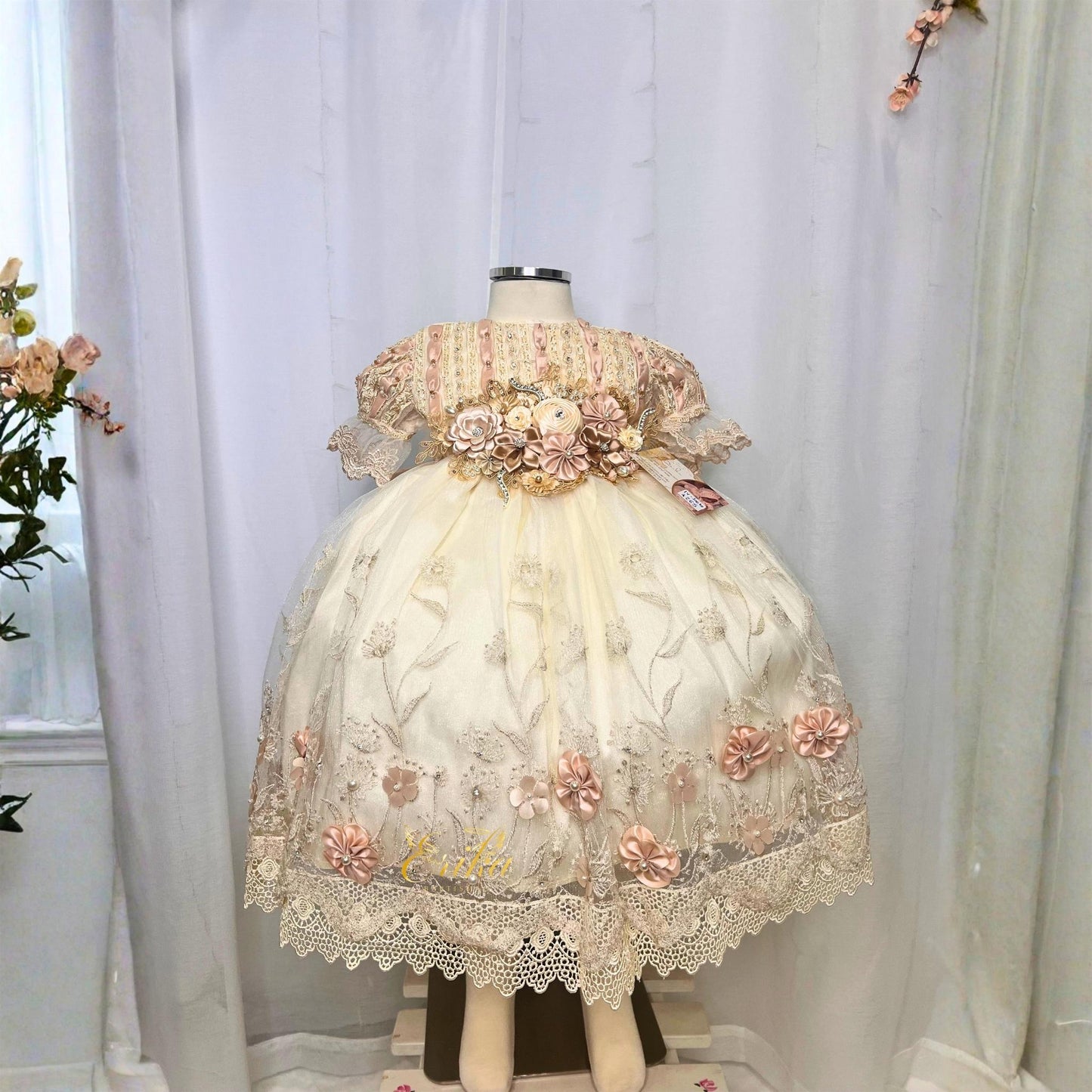 delicate baby christening short dress with lace details and embedded floral accents in lightweight fabric