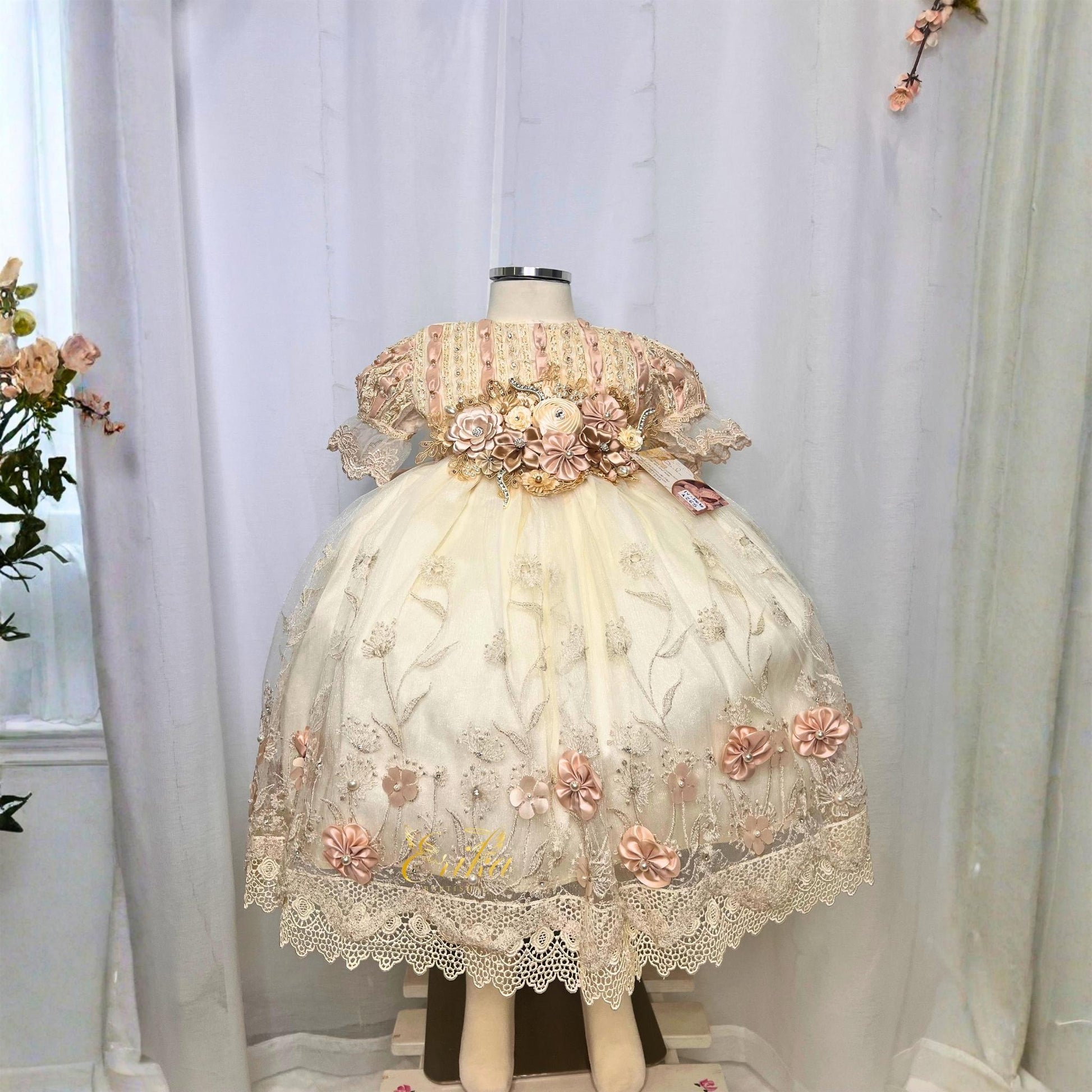 delicate baby christening short dress with lace details and embedded floral accents in lightweight fabric