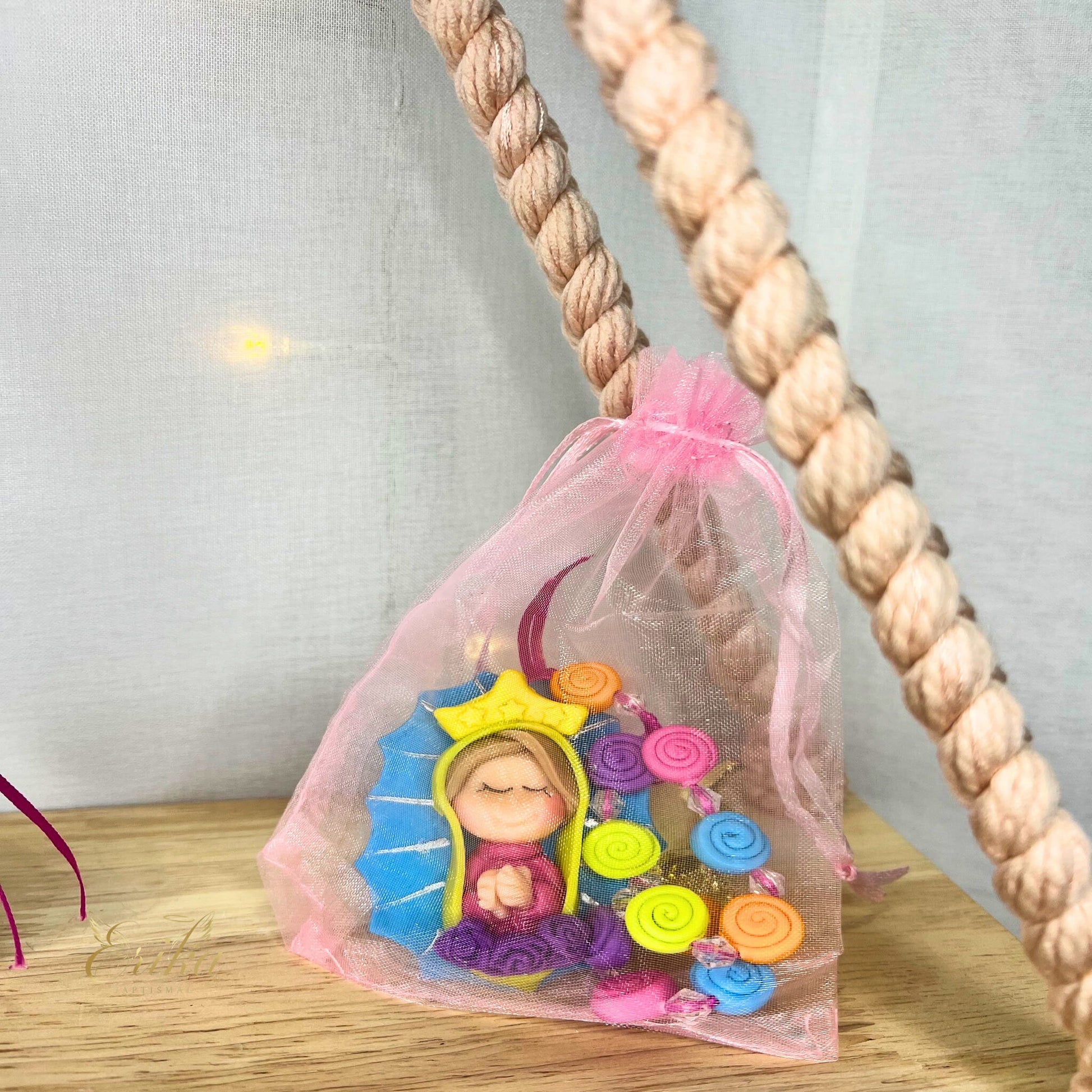 Cold porcelain baptism favor in a soft tulle bag by Erika Baptismal