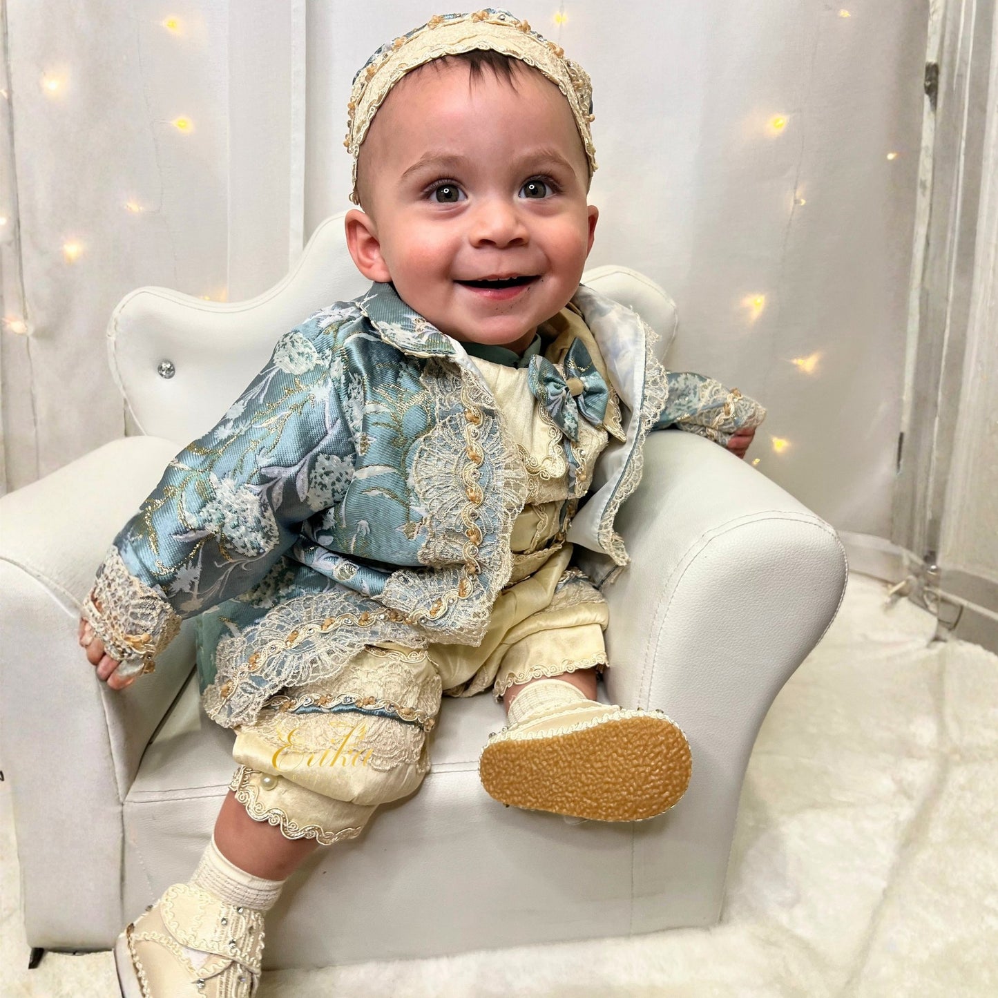 elegant baby boy baptism outfit in blue and pearl with lace details and soft refined fabric