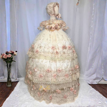 elegant baby baptism dress with lace layers and embedded floral decorations in soft fabric