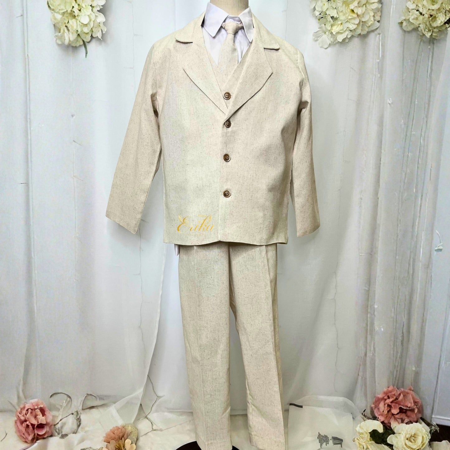 elegant pearl cream boys first communion suit by Erika Baptismal with refined details and soft fabric