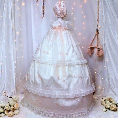 elegant long white baby baptism gown with delicate floral embroidery and soft tulle hem