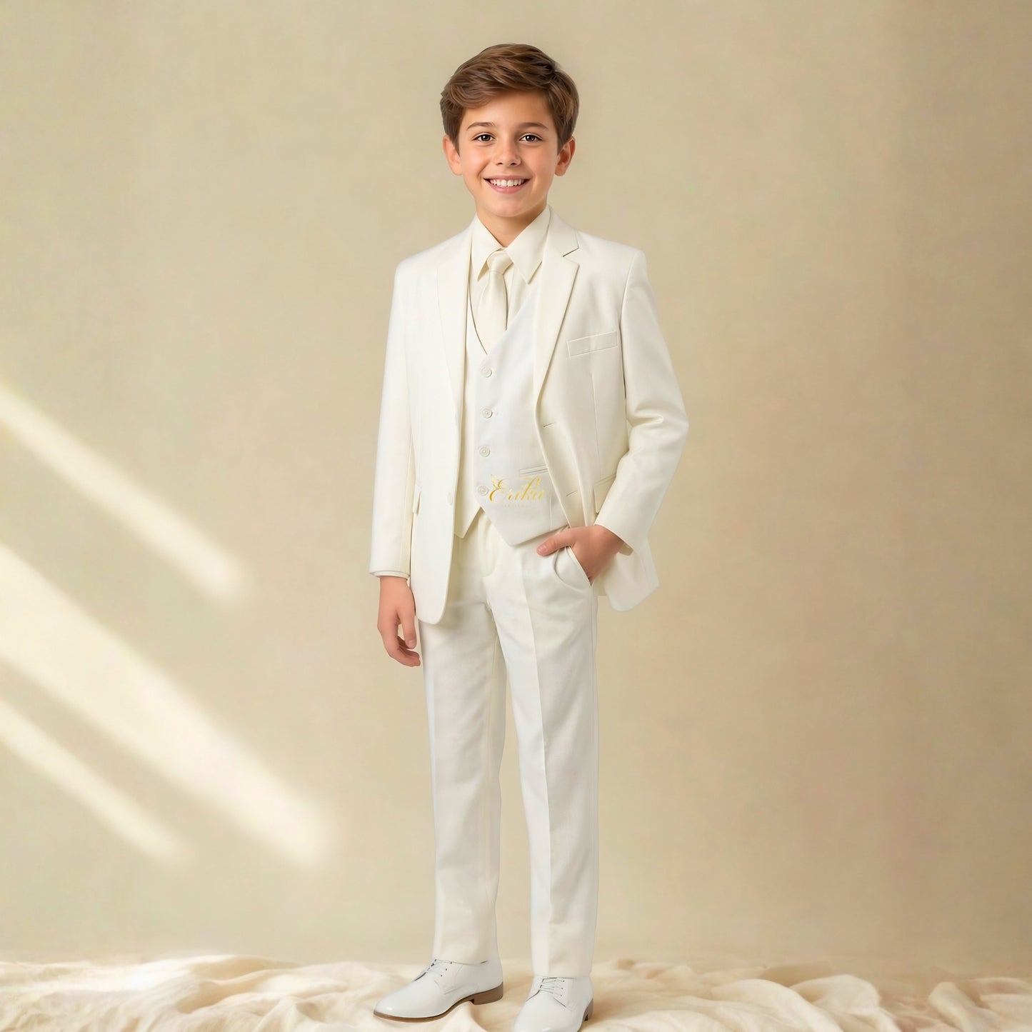 ice white boys first communion suit by Erika Baptismal with elegant tailored design and soft premium fabric