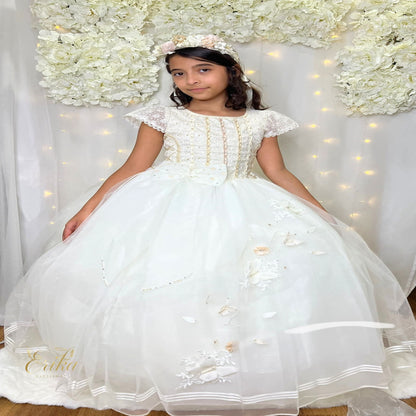 Exquisite pearl communion dress featuring a jeweled bodice with gold and crystal accents.