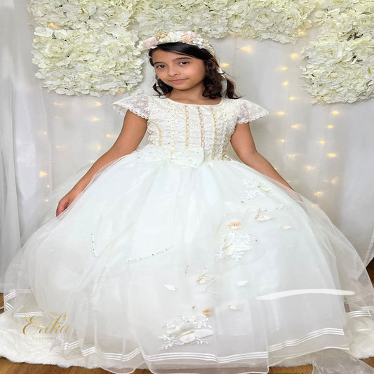 Exquisite pearl communion dress featuring a jeweled bodice with gold and crystal accents.