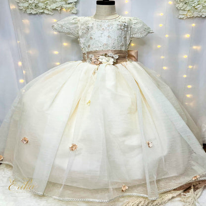 Close-up of the adjustable corset back and 3D floral appliqués with pearl centers on a Communion gown