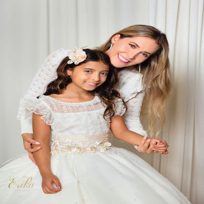 Front view of a white First Communion dress with 3D flowers and a voluminous tulle skirt