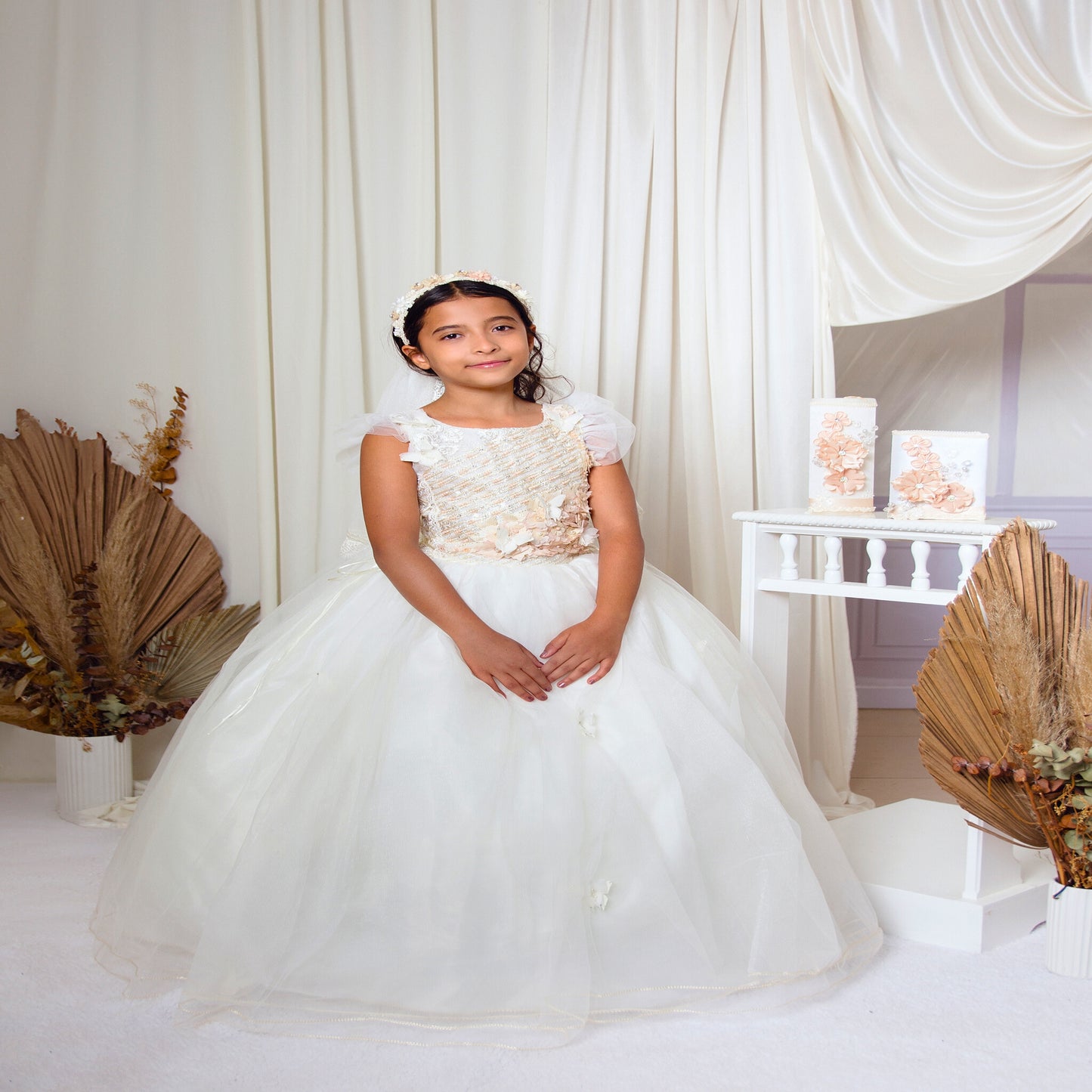 Detailed side view of the Mariposa communion dress showing the adjustable lace-up corset and floral embroidery
