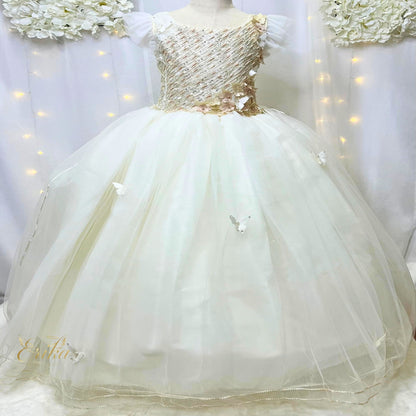 Detail of the multi-layered pearl tulle skirt on the Mariposa model communion dress for a royal look