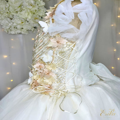 Macro shot of the delicate 3D butterfly appliqués on the Mariposa model communion gown by erika baptismal