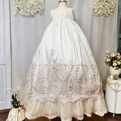 modern white baby christening gown with clean lines and soft elegant fabric