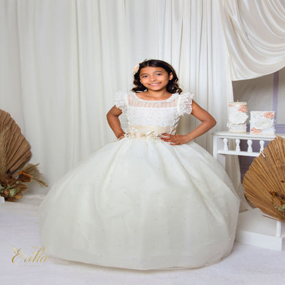 Side detail of a white First Communion gown showing the lace-up corset and 3D floral appliqués