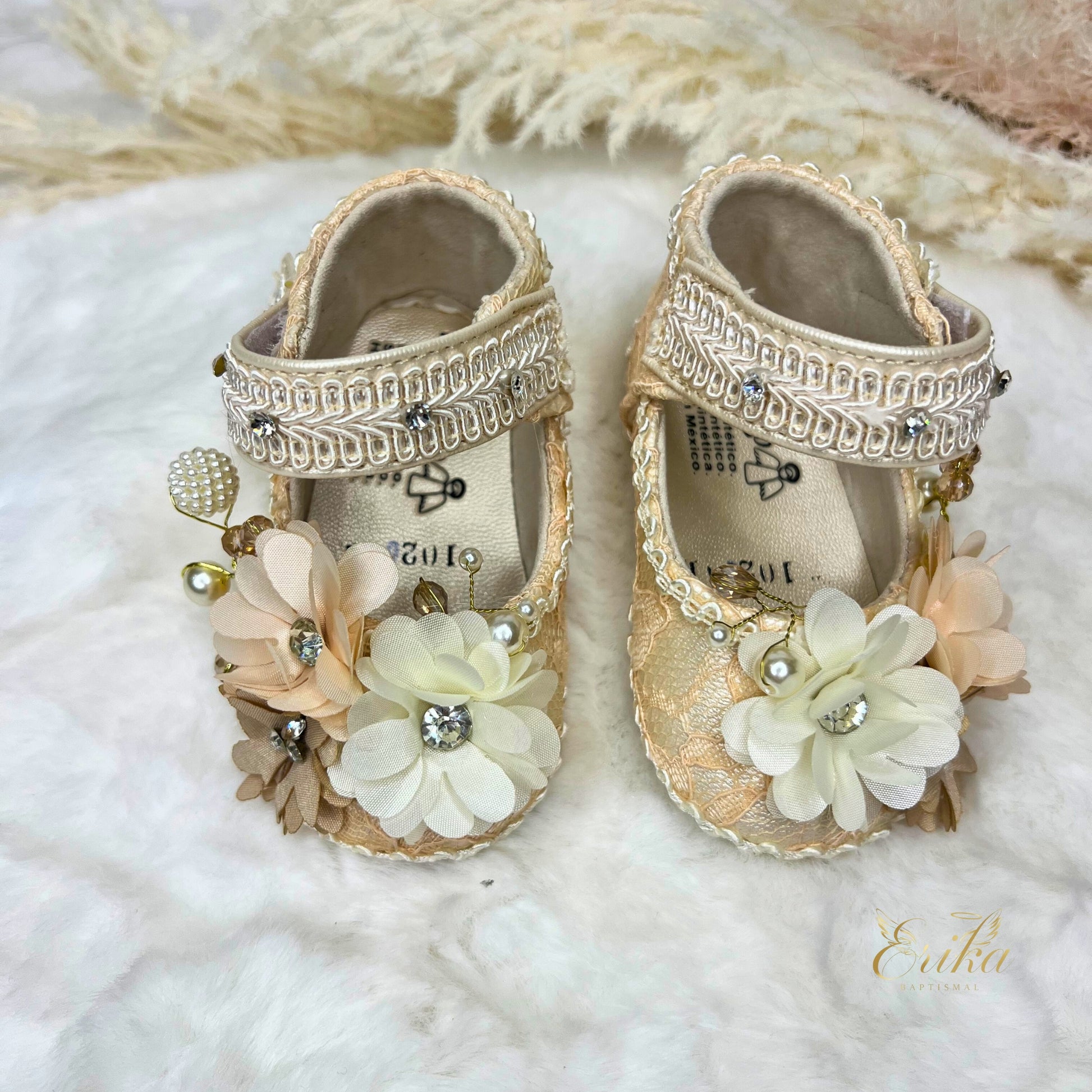 Pearl christening shoes for baby girls with 3D floral appliqués and soft soles.