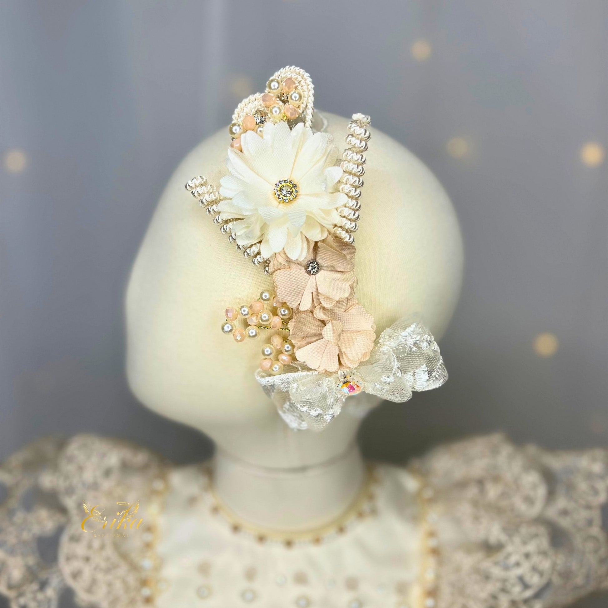 baby headband in pearl color with floral details soft fabric and delicate design