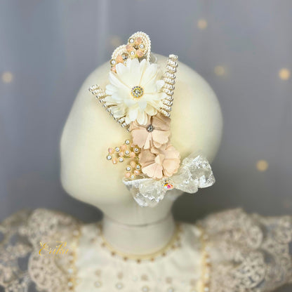 baby headband in pearl color with floral details soft fabric and delicate design
