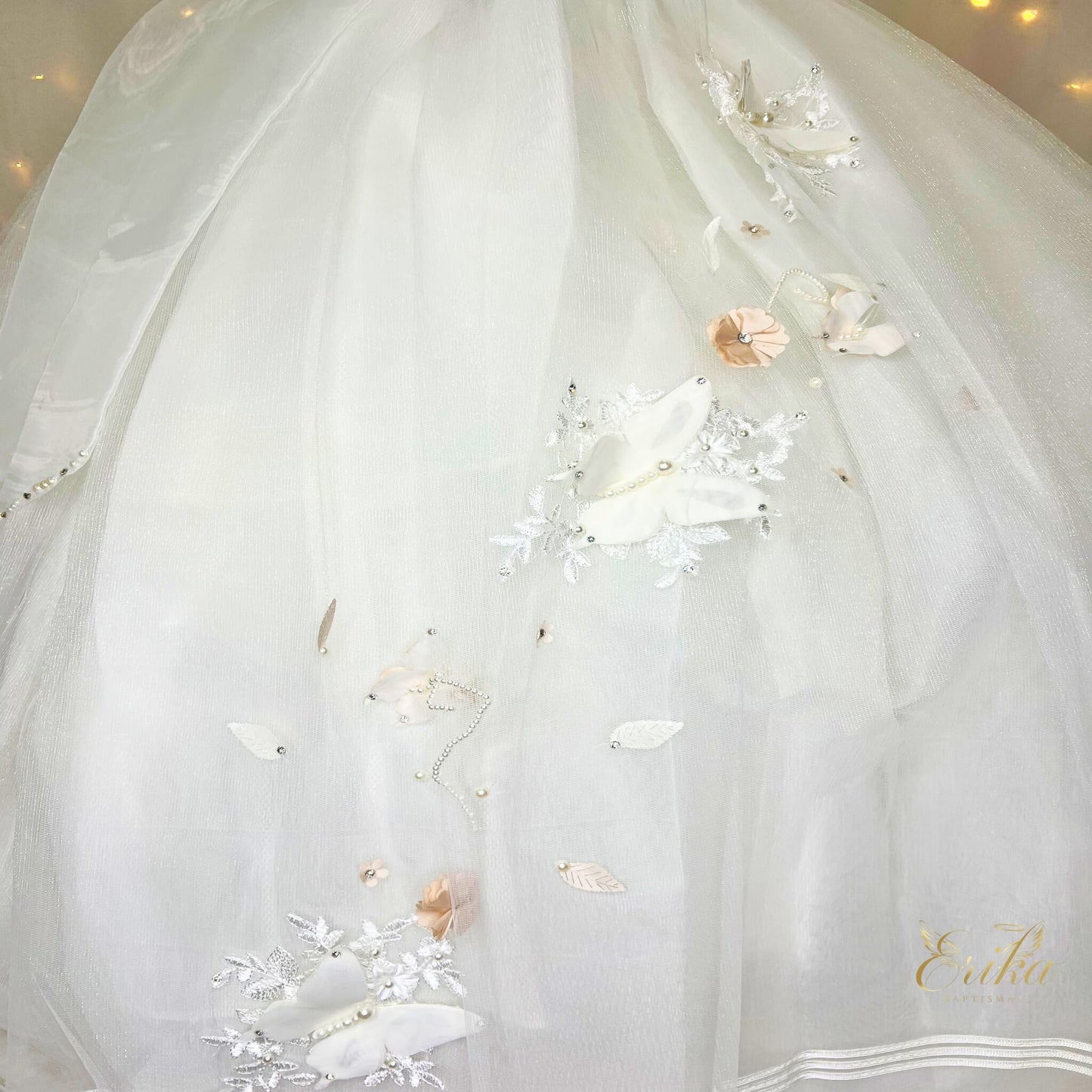 Pearl-toned First Communion dress with signature 3D butterfly details on the bodice