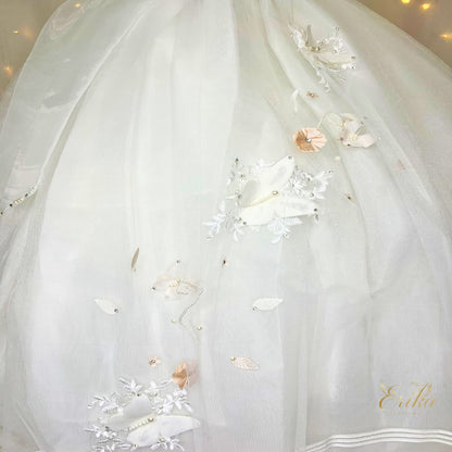 Pearl-toned First Communion dress with signature 3D butterfly details on the bodice