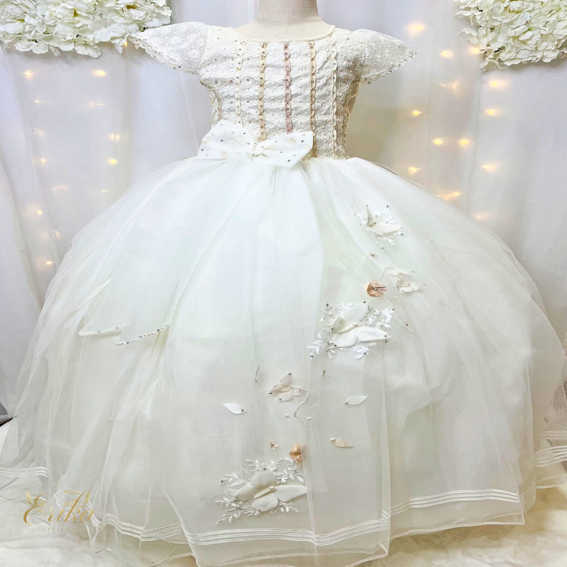 Detailed side view of the Sacred First Communion butterfly dress with lace-up corset.