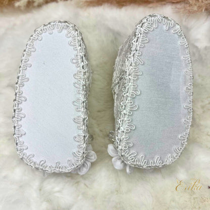 Soft-soled baby girl baptism shoes with delicate petal overlays