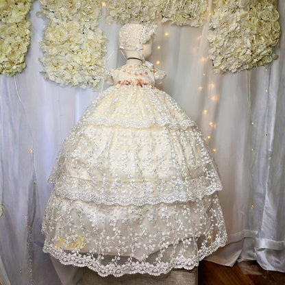 long baby christening gown in Spanish style with lace ruffles and floral waist detail in soft elegant fabric