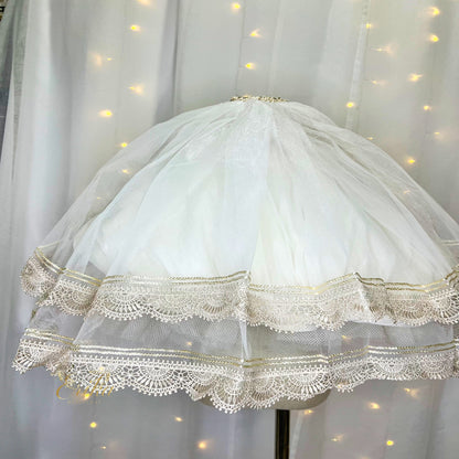 First Communion veil featuring an intricate and heavy double lace design