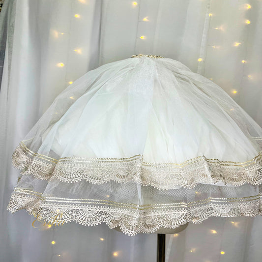 First Communion veil featuring an intricate and heavy double lace design