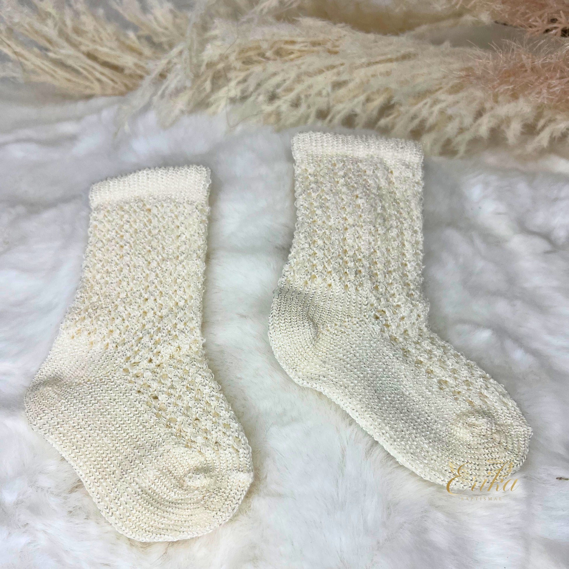 Cream pointelle knit knee-high socks for baby baptism with delicate openwork pattern