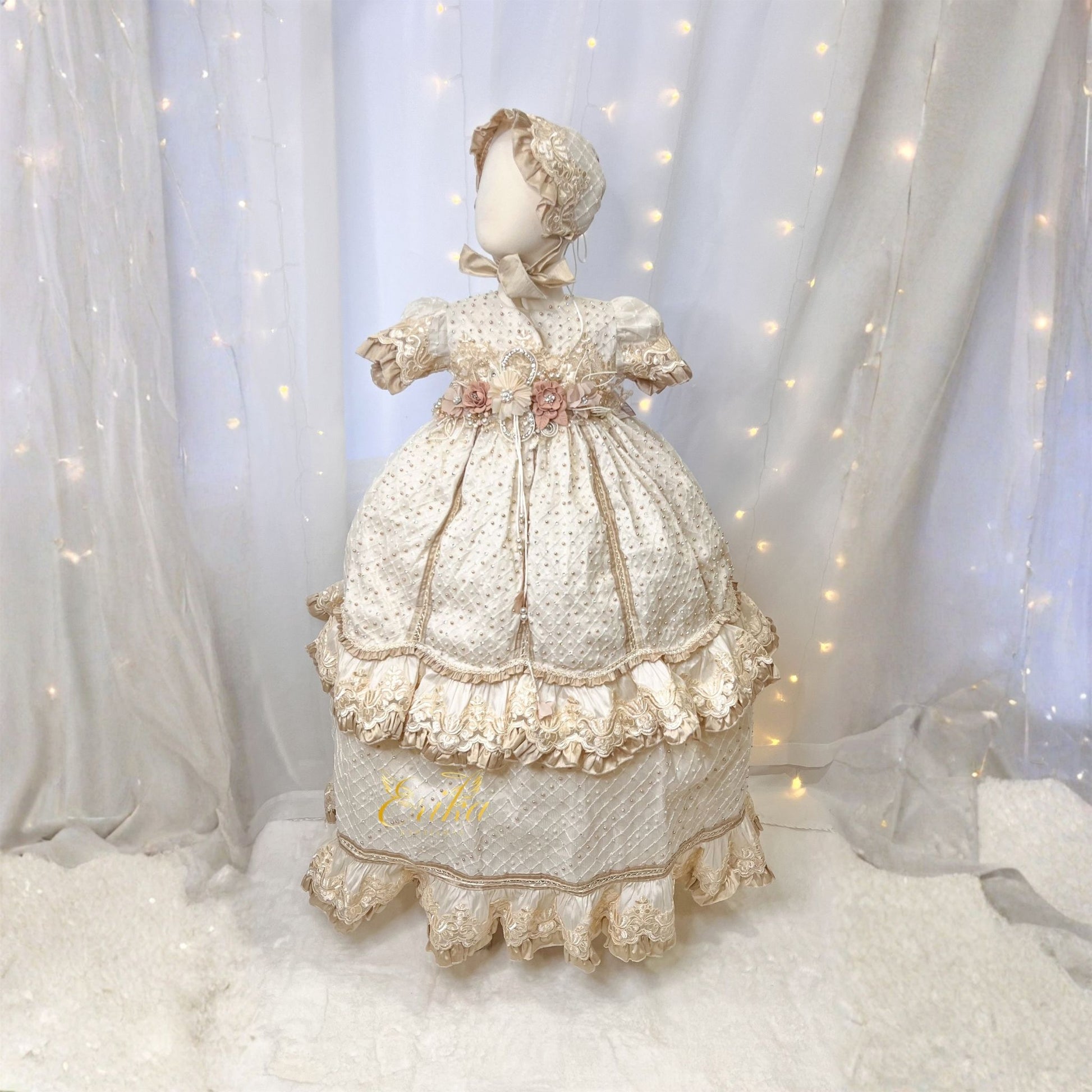 vintage style baby christening gown with gold accents floral embroidery and elegant soft fabric