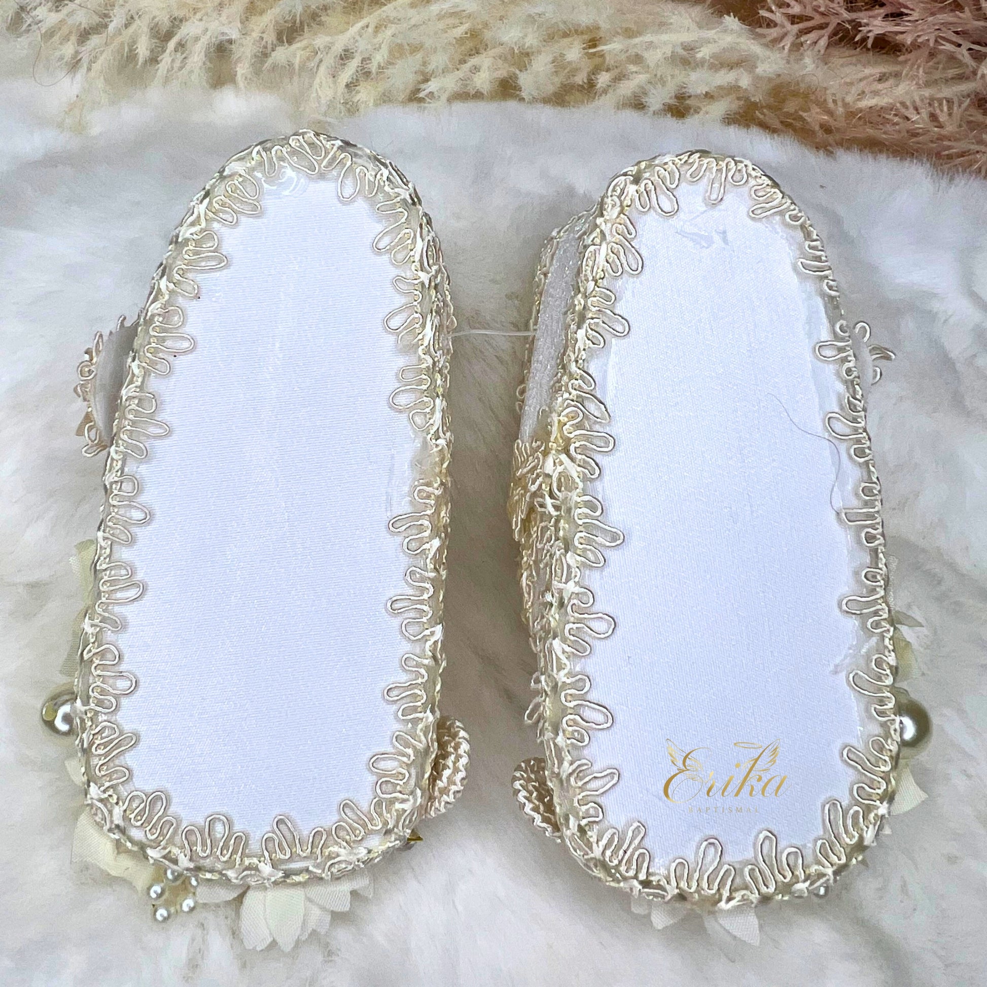 White lace baptismal shoes for girls with central flower appliqué