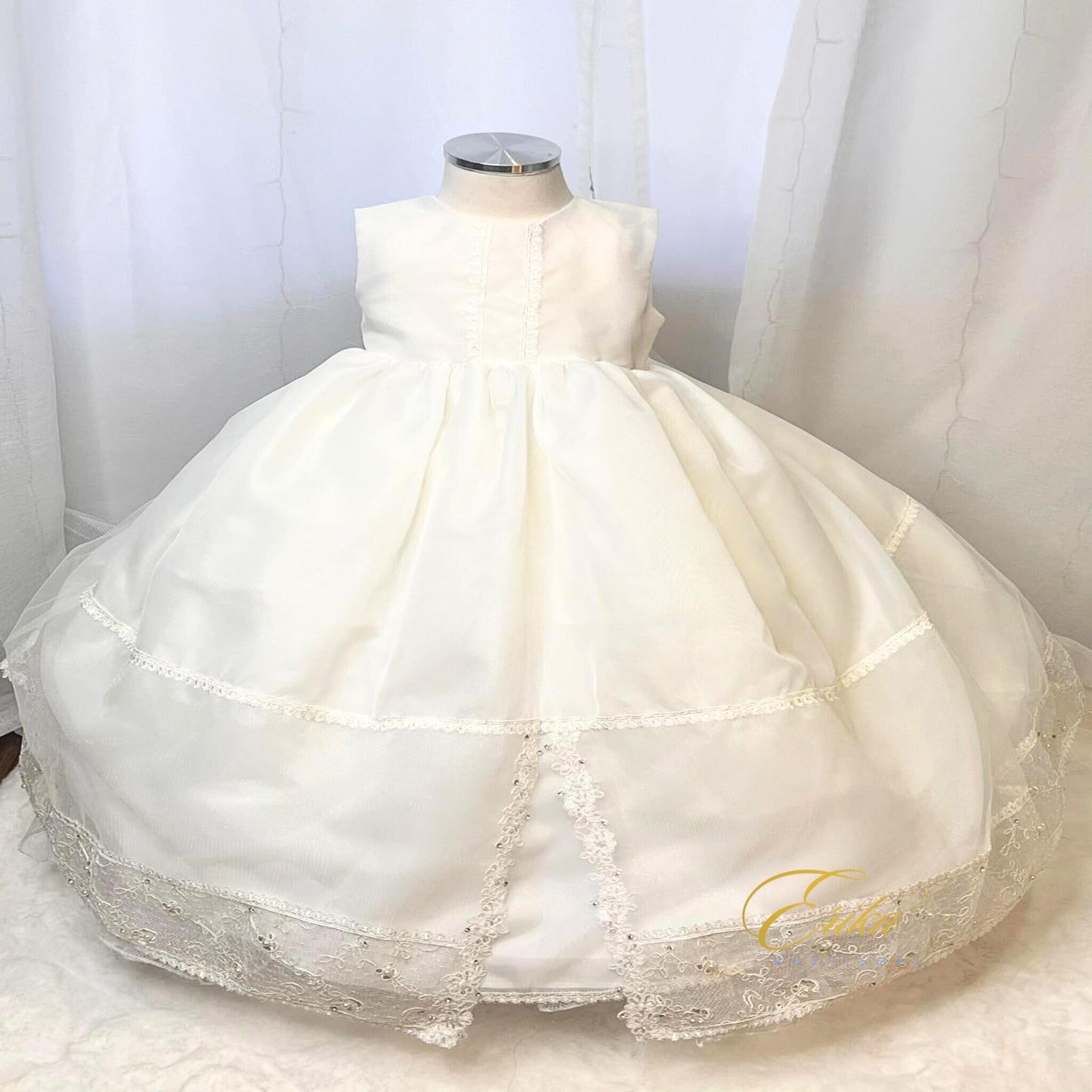 premium baby christening gown with floral lace accents and soft flowing fabric